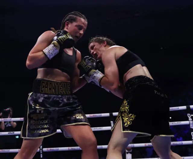 Chantelle Cameron throws a punch at Katie Taylor