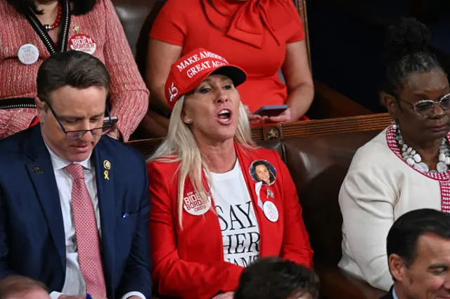 The Georgia Republican was seen shouting at Biden as he spoke about immigration