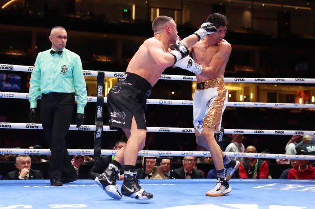 Nick Ball throws a punch at Rey Vargas