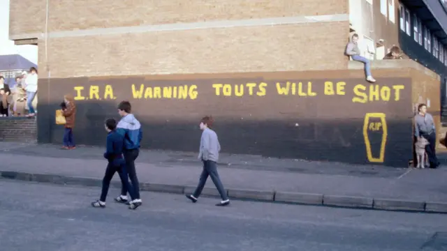 Graffiti reading "IRA WARNING TOUTS WILL BE SHOT'