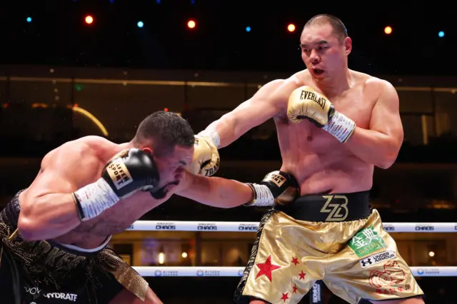 Joseph Parker lands a body punch on Zhilei Zhang