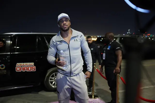 Anthony Joshua in grey tracksuit