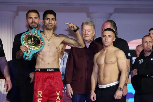 Rey Vargas holds his WBC featherweight title and stands next to Nick Ball