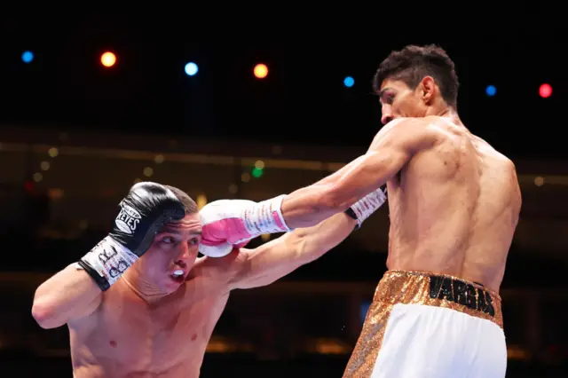 Nick Ball ducks a punch from Rey Vargas