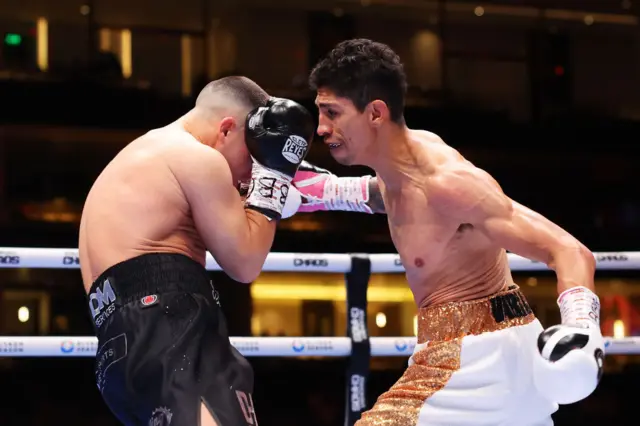 Rey Vargas throws a hook at Nick Ball