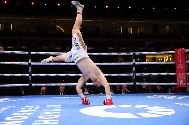 Israil Madrimov does a cartwheel to celebrate his win