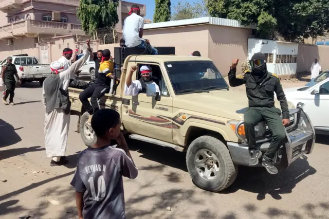 Supporters of the Sudanese armed popular resistance, which backs the army, ride on trucks in a show of solidarity in Gedaref in eastern Sudan on March 3, 2024, amid the ongoing conflict