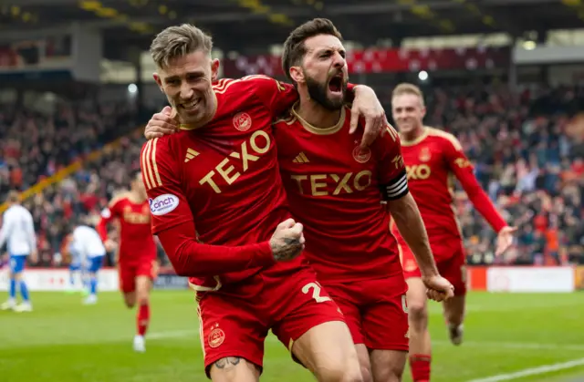 Aberdeen's Graeme Shinnie (R) celebrates scoring to make it 2-0 with teammate Anges MacDonald (L) during a Scottish Cup Quarter Final match between Aberdeen and Kilmarnock at Pittodrie Stadium, on March 09, 2024, in Aberdeen, Scotland.