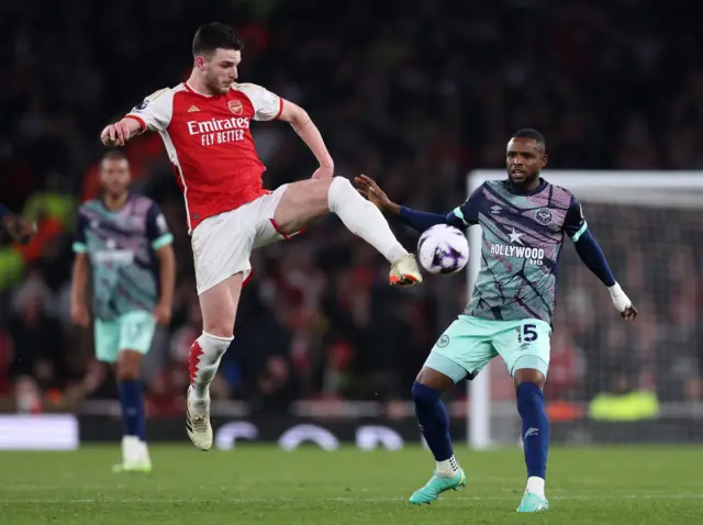 Declan Rice in action with Frank Onyek