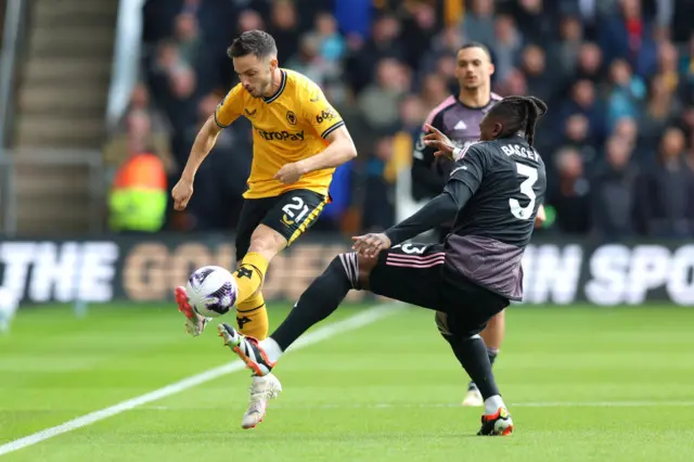 Pablo Sarabia of Wolverhampton Wanderers is challenged by Calvin Bassey