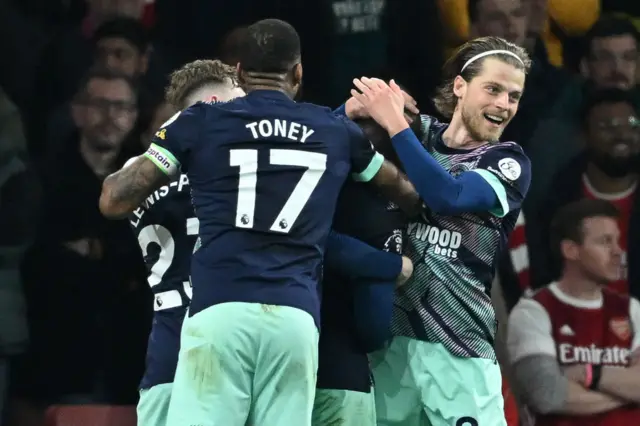 Yoane Wissa celebrates with teammates after scoring