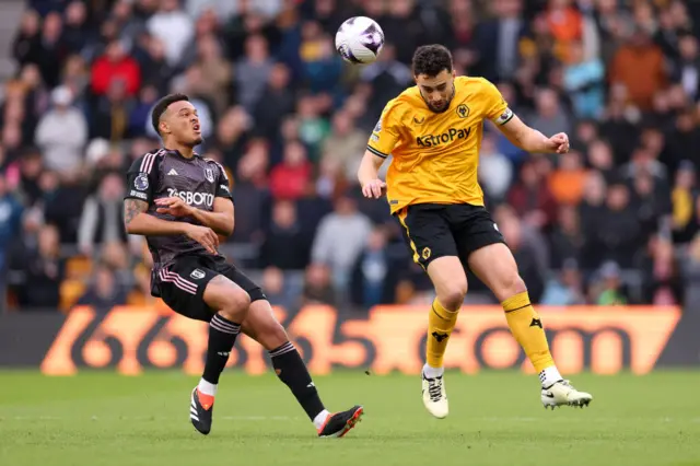 Max Kilman heads the ball