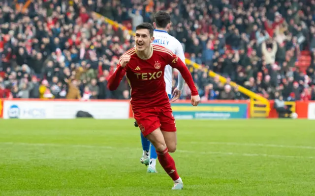 Aberdeen's Jamie McGrath (L) celebrates as his shot is deflected into the net off  Stuart Findlay to make it 3-1 during a Scottish Cup Quarter Final match between Aberdeen and Kilmarnock at Pittodrie Stadium, on March 09, 2024, in Aberdeen, Scotland.