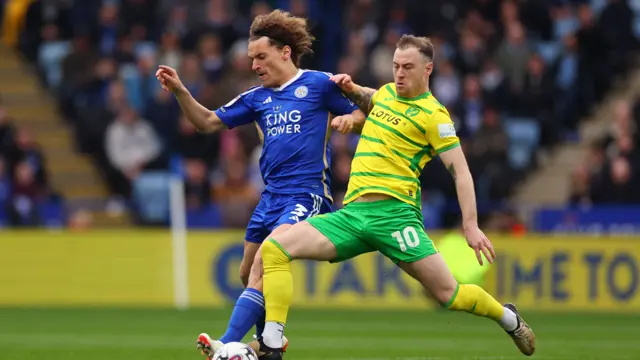 Wout Paes and Ashley Barnes challenge for the ball