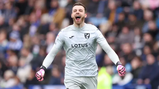 Leicester keeper Angus Gunn celebrates