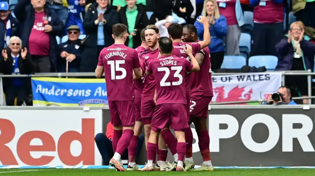 Cardiff players celebrate a goal