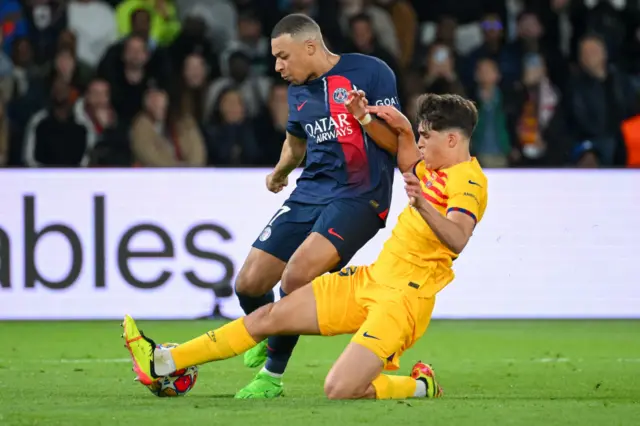 Pau Cubarsi and Kylian Mbappe