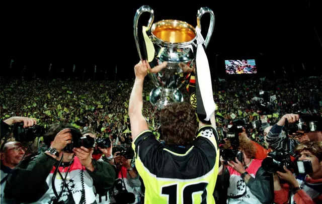 Andreas Moller lifting the Champions League trophy for Borussia Dortmund