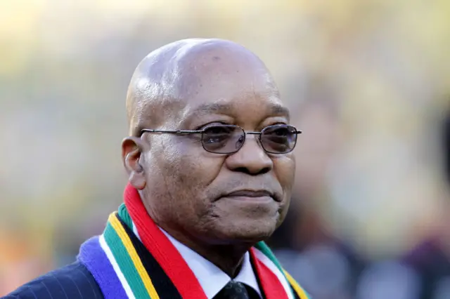 Jacob Zuma wearing a scarf with the colours of the SA flag