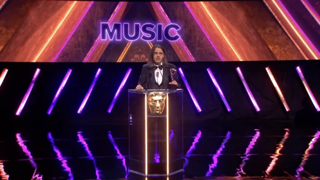 Borislav Slavov accepting the music award on stage