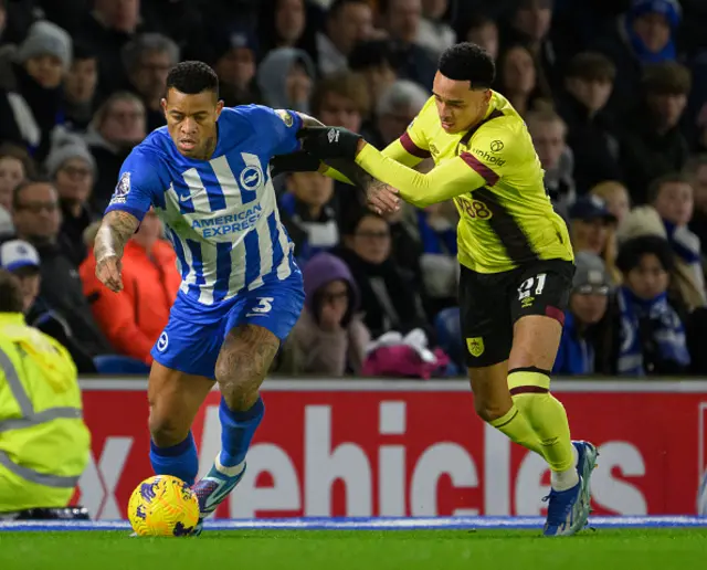 Burnley's Aaron Ramsey (right) battles with Brighton & Hove Albion's Igor Julio