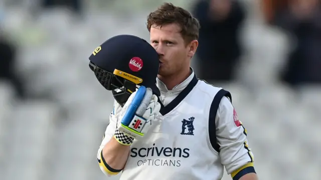 Alex Davies celebrates scoring a double century