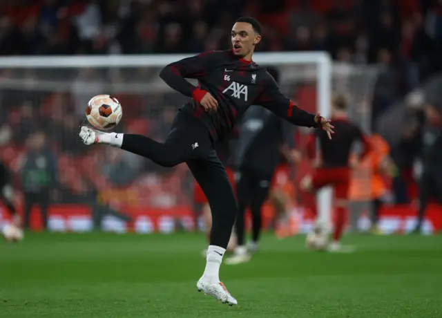 Trent Alexander-Arnold warms up before Liverpool's game against Atalanta