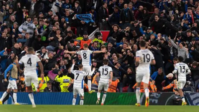 Atalanta players celebrate after scoring at Liverpool