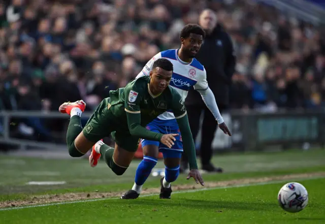 Plymouth's Morgan Whittaker goes down in a tackle against QPR