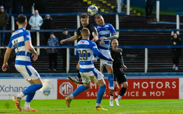 Dundee United's Ross Docherty scores with a header