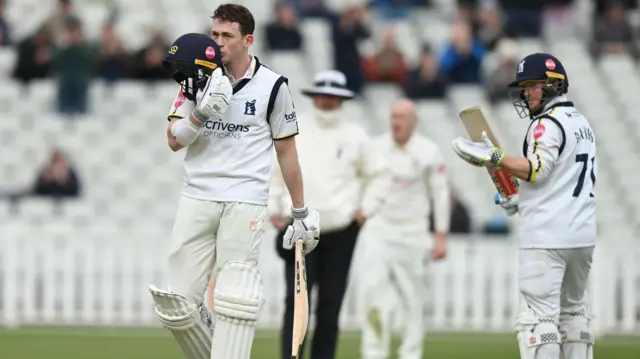 Rob Yates celebrates scoring a century