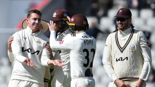 Surrey celebrate a Dan Lawrence wicket