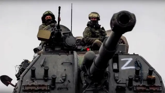 A still image taken from a handout video made available by the Russian Defence Ministry press service shows Russian servicemen drive on a 152mm self-propelled artillery system MSTA-S on the march near Kyiv (Kiev), Ukraine, 07 March 2022