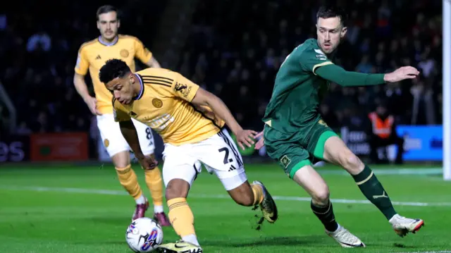 Leicester's James Justin battles Ryan Hardie of Plymouth Argyle