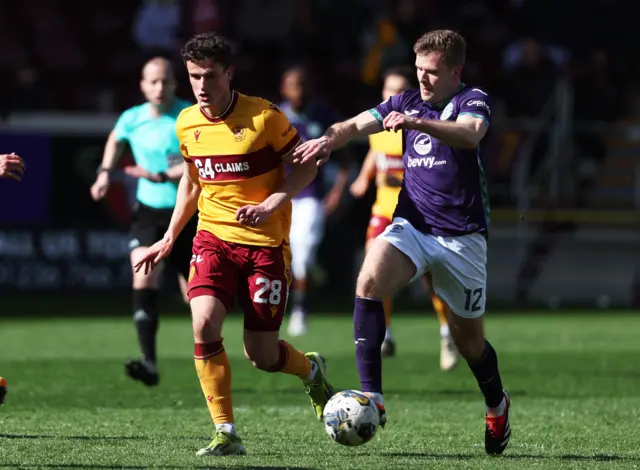 Hibs Chris Cadden and Motherwell's Jack Vale in action during a cinch Premiership match between Motherwell and Hibernian