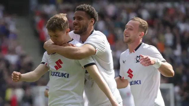 Max Dean celebrates scoring MK Dons' first goal