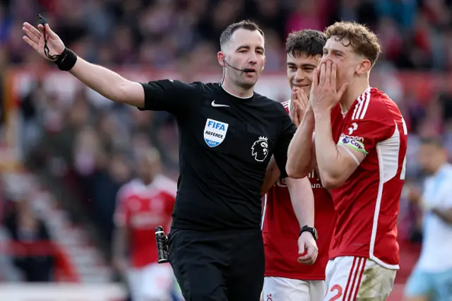 Referee Chris Kavanagh, pointing with Gio Reyna and Ryan Yates