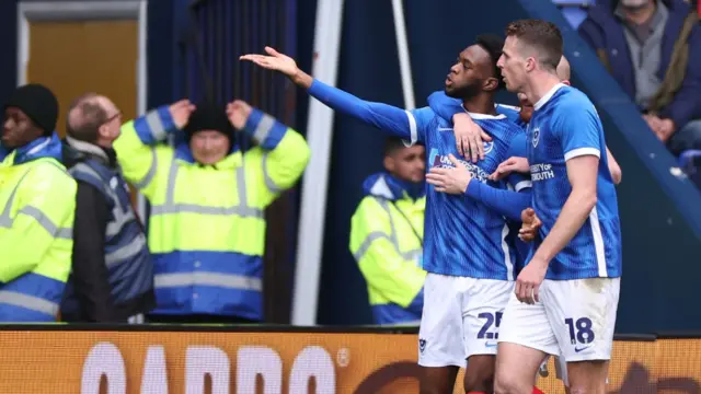 Abu Kamara celebrates giving Portsmouth the lead at Bolton