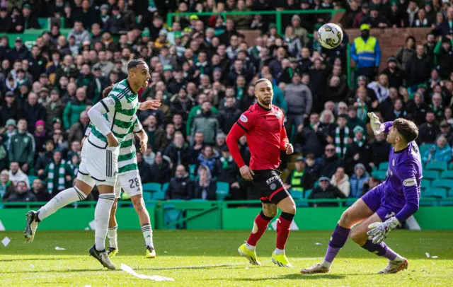 Adam Idah heads in the third goal for Celtic