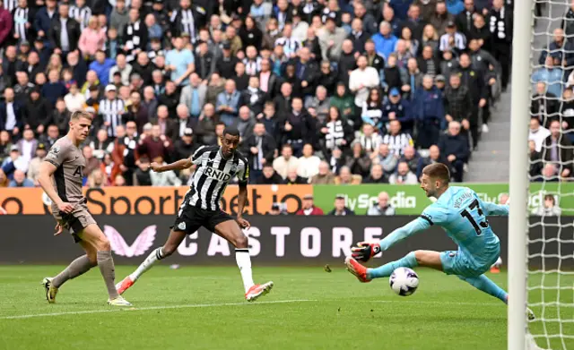 Alexander Isak looks on as his shot goes past Vicario