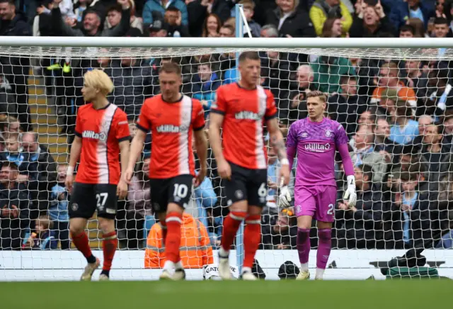 Luton Town's Thomas Kaminski looks dejected