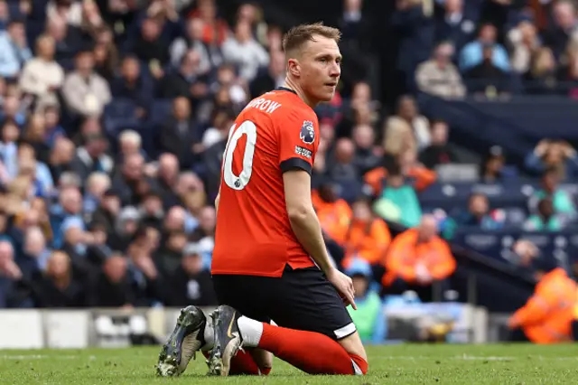 Cauley Woodrow reacts to a missed chance