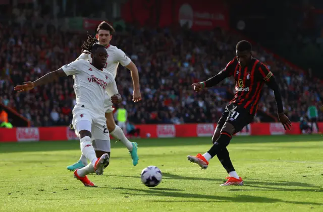 Dango Ouattara shoots at goal as Manchester United's Aaron Wan-Bissaka reacts