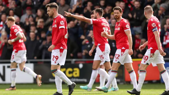 Wrexham celebrate their opening goal