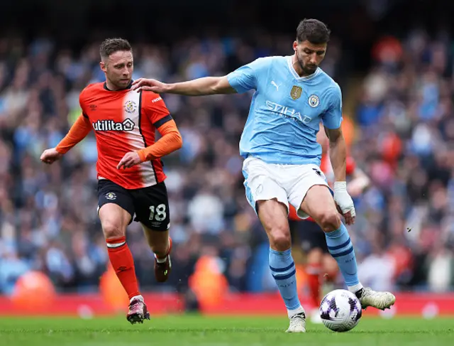 Jordan Clark chases down Ruben Dias