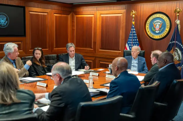 US president Joe Biden speaking to his national security advisers. They are sitting round a table in the White House situation room, including Secretary of State Antony Blinken and Defense Secretary Lloyd Austin.