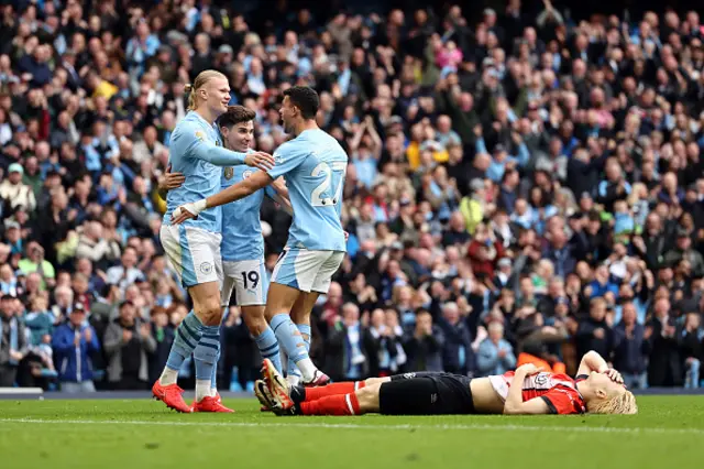 Erling Haaland celebrates after breaking the deadlock, Daiki Hashioka lays on the floor