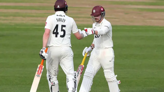 Dom Sibley and Rory Burns touch gloves