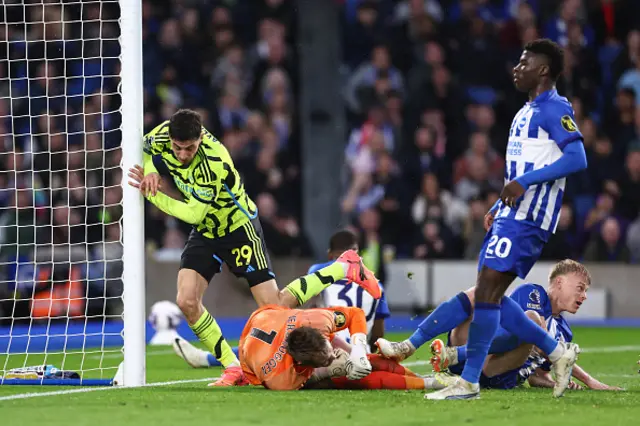 Kai Havertz of Arsenal falls into the goal post as he scores