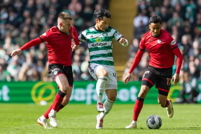 eltic's Reo Hatate against St Mirren's Caolan Boyd-Munce and Keanu Baccus